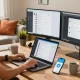 Explore the Telegram Web Version in a modern home office setup with laptops and plants.